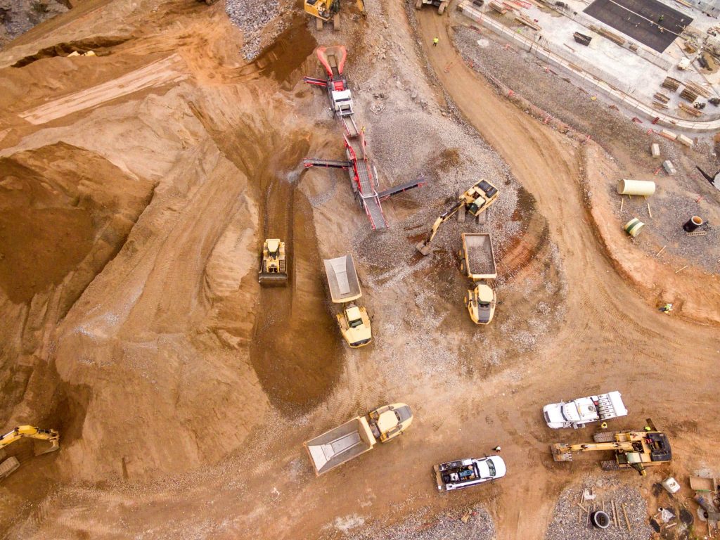 Bulldozers and other construction trucks in action.